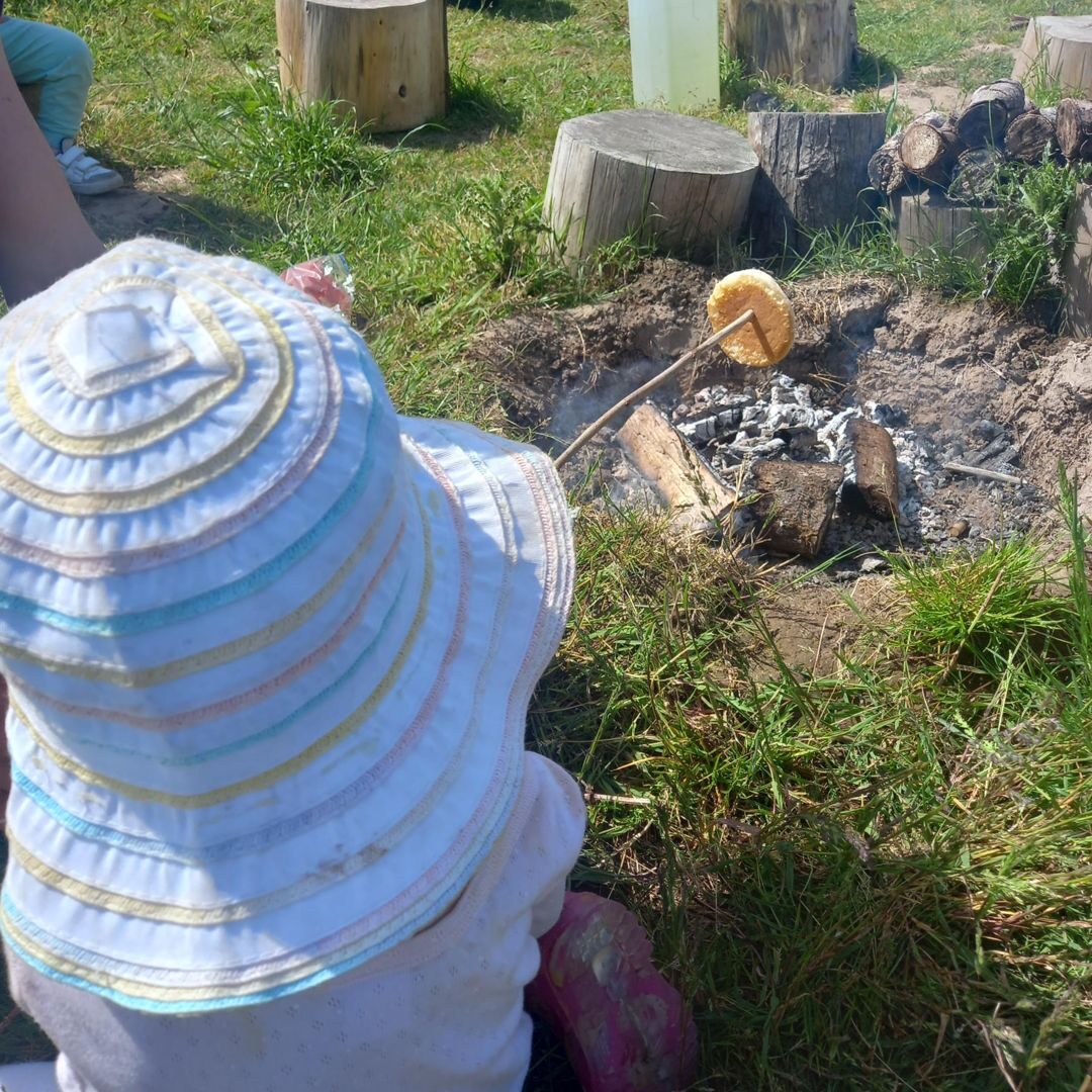 A child relaxing on a blanket outdoors
